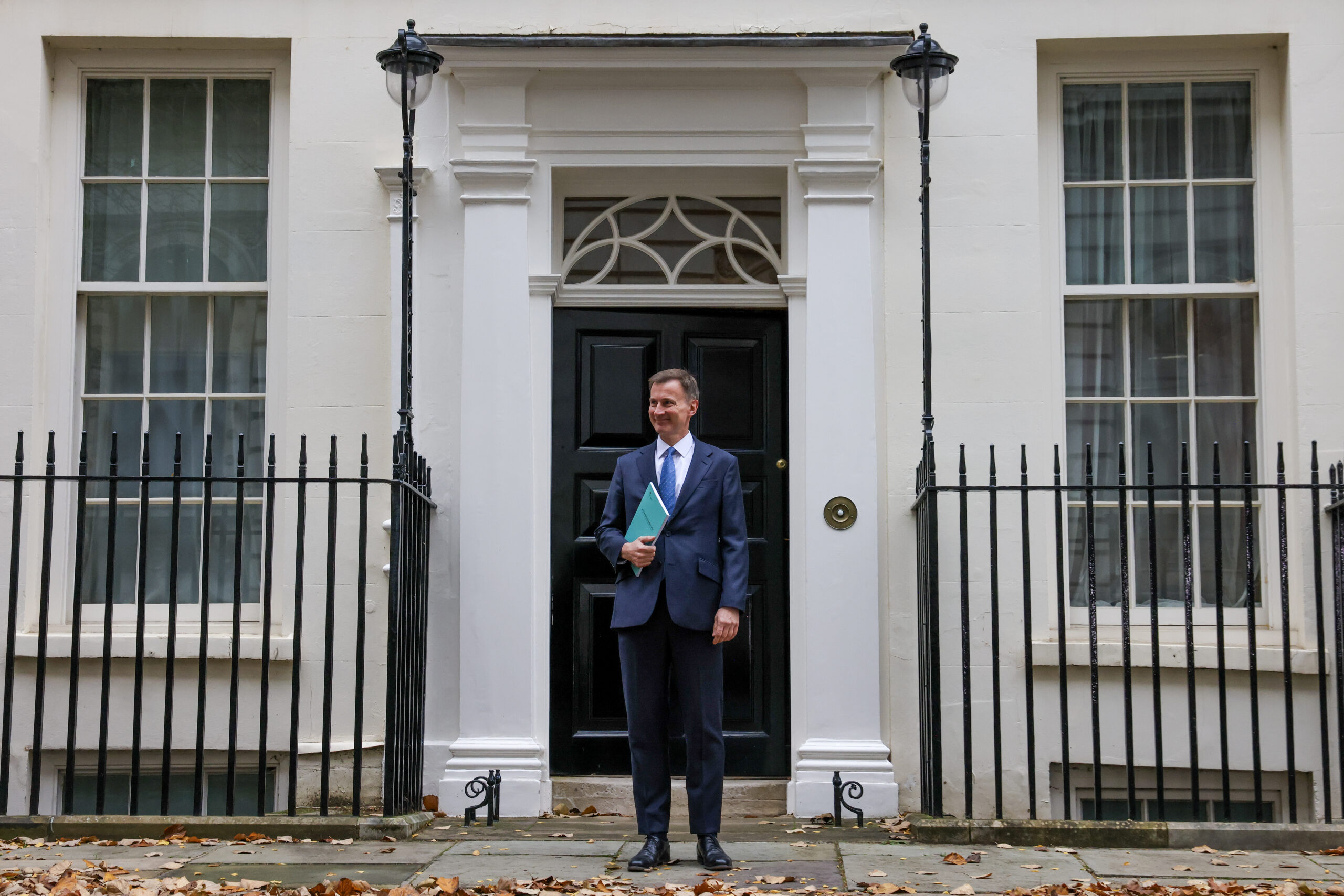 Chancellor of the Exchequer Jeremy Hunt leaves 11 Downing Street holding a copy of the Autumn Statement 2023.